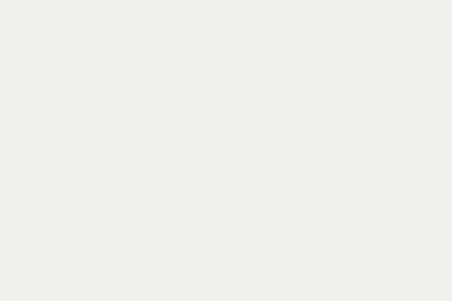 Bass fishing shirts laid out on a boat deck